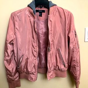 Small pink bomber jacket with a grey hood.
